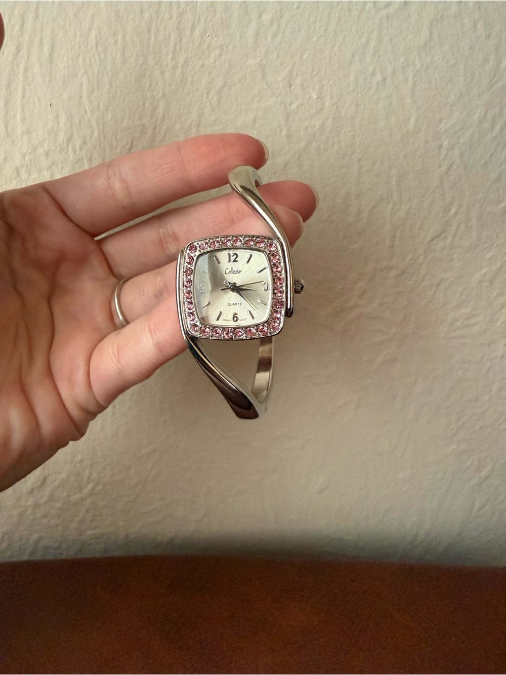 Silver-Tone Bangle Watch with Pink Stud Accents